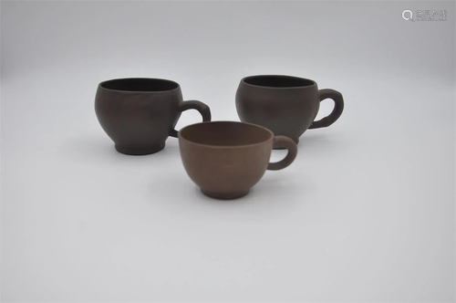 Three purple sand cups