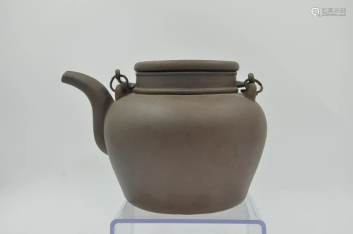 famous dark-red enameled pottery teapot