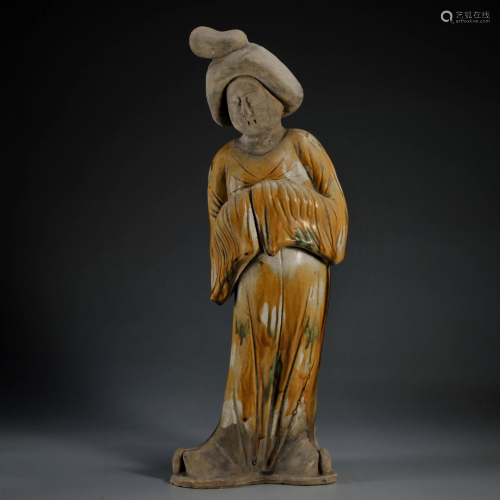 A Sancai Glazed Standing Pottery Figure Tang Dynasty