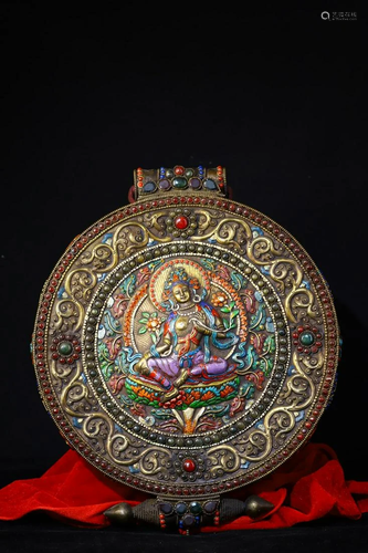 Tibetan silver is hand beaten, engraved, and painted