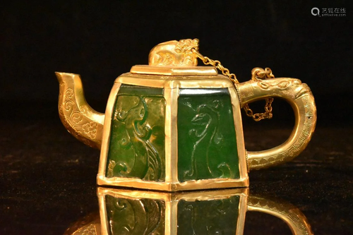 The gold-clad jade pot has a unique shape, clear