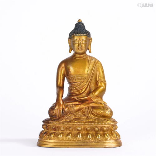 A CHINESE GILT BRONZE SEATED FIGURE OF SAKYAMUNI