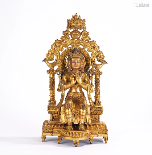 A CHINESE GILT BRONZE SEATED FIGURE OF GUANYIN BUDD…