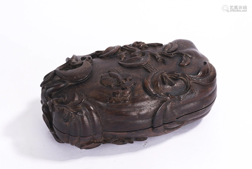 A CHINESE HARDWOOD CARVED FREE-FORM BOX AND COVER