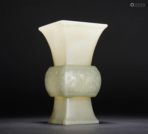 A CHINESE WHITE JADE VASE ENGRAVED WITH TAOTIE