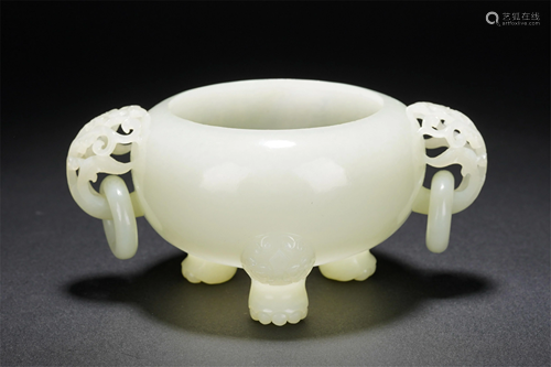 A CHINESE WHITE JADE TRIPOD CENSER WITH DOUBLE HA…