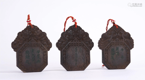 A GROUP OF CHINESE CHENXIANG WOOD PENDANTS