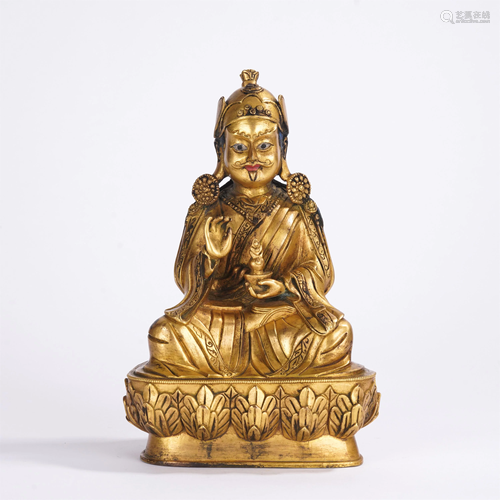 A CHINESE GILT BRONZE SEATED FIGURE OF BUDDHA