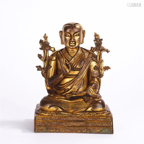 A CHINESE GILT BRONZE SEATED FIGURE OF GURU