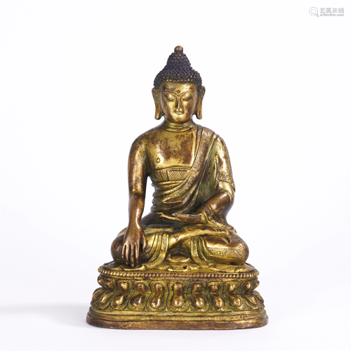 A CHINESE GILT BRONZE SEATED FIGURE OF SAKYAMUNI