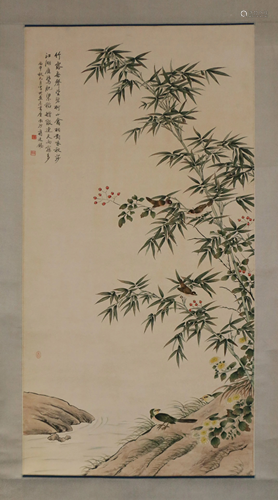 A CHINESE SCROLL PAINTING OF BAMBOO AND BIRDS