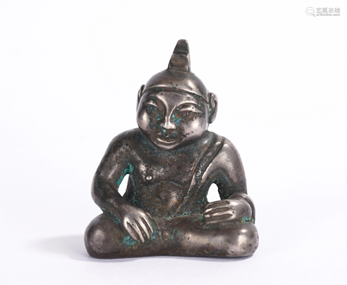 A CHINESE SILVER SEATED FIGURE