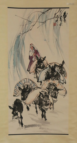 A CHINESE SCROLL PAINTING OF FIGURE AND DONKEYS