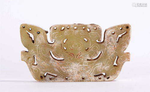 A CHINESE HOLLOW-CARVED JADE BI