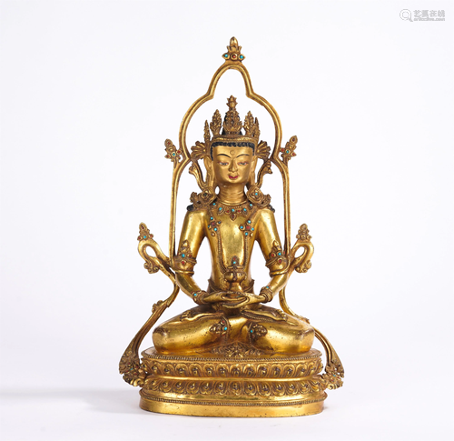 A CHINESE GILT BRONZE SEATED FIGURE OF BUDDHA