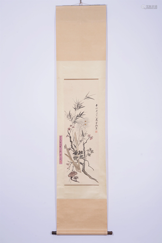 A CHINESE SCROLL PAINTING OF BAMBOO AND FLOWERS