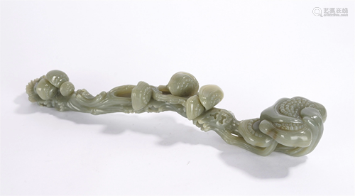 A CHINESE CARVED PALE CELADON JADE RUYI