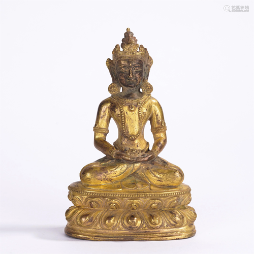 A CHINESE GILT BRONZE SEATED FIGURE OF BUDDHA