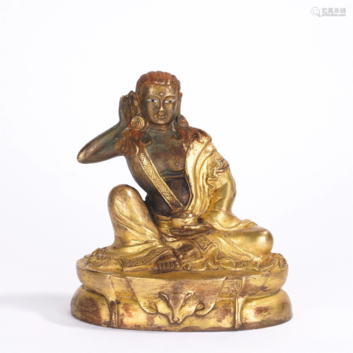 A CHINESE GILT BRONZE SEATED FIGURE OF GURU