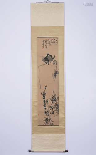 A CHINESE SCROLL PAINTING OF TWO BIRDS ON A ROCK