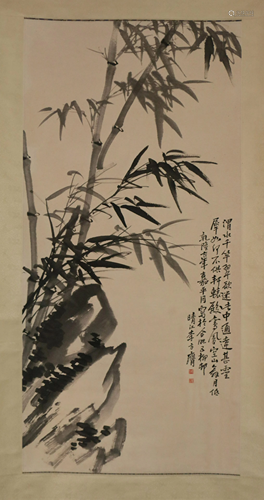 A CHINESE SCROLL PAINTING OF BAMBOO AND ROCK