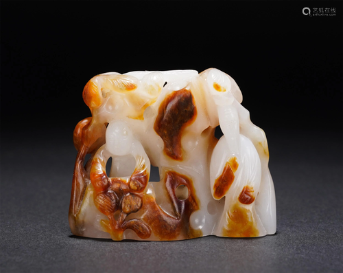 A CHINESE CARVED JADE DECORATION OF MYTHICAL FIGURES