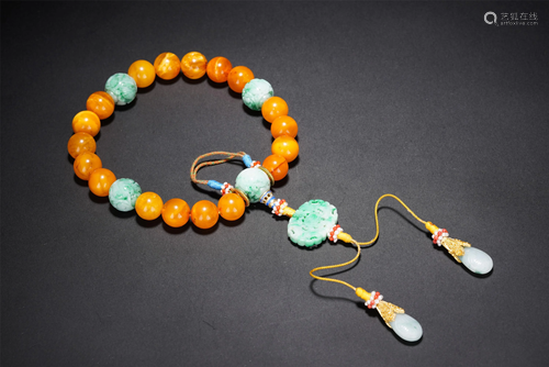 A CHINESE 18-BEAD CLOUDY AMBER PRAYER BEADS