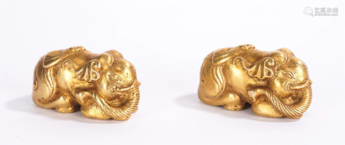 A PAIR OF CHINESE GILT BRONZE ELEPHANT MAT-WEIGHTS