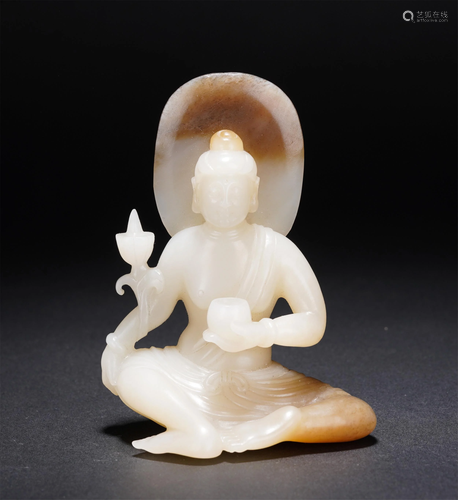 A CHINESE WHITE JADE SEATED FIGURE OF BUDDHA GUAN…