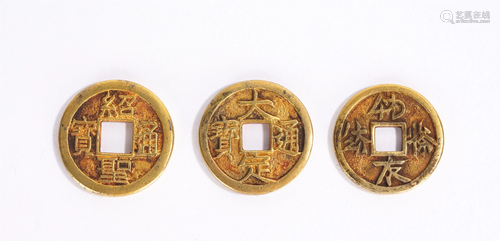 A GROUP OF CHINESE GILT SILVER COINS