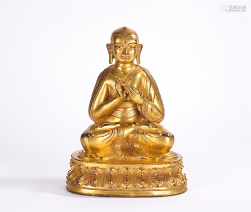 A CHINESE GILT BRONZE SEATED FIGURE OF BUDDHA