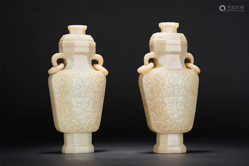 A PAIR OF CHINESE WHITE JADE DOUBLE-HANDLED VASES