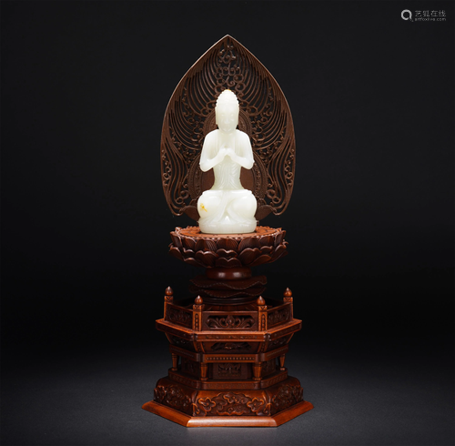 A CHINESE WHITE JADE FIGURE OF SAKYAMUNI AND PEDES…