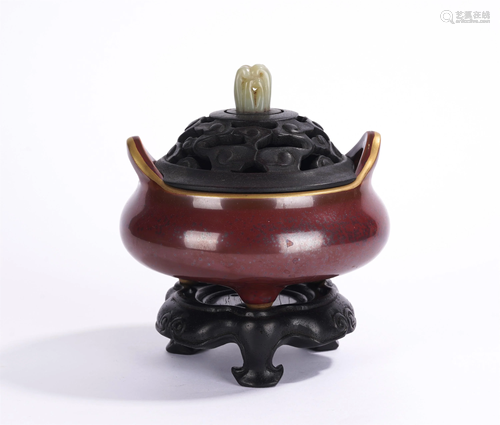 A CHINESE RED GLAZED TRIPOD INCENSE BURNER