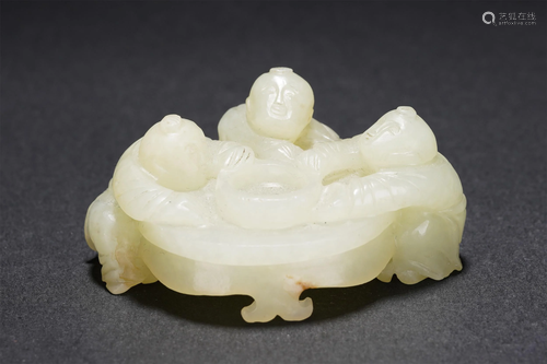 A CHINESE WHITE JADE CARVED CHILDREN-AT-PLAY DECORA…