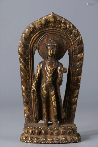 A GILT BRONZE STANDING SAKYAMUNI BUDDHA STATUE