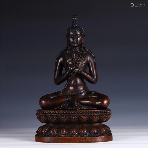 A CHINESE CHENXIANG WOOD SEATED FIGURE OF BUDDHA