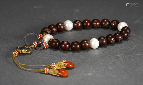 A CHINESE 18-BEAD ZITAN WOOD PRAYER BEADS