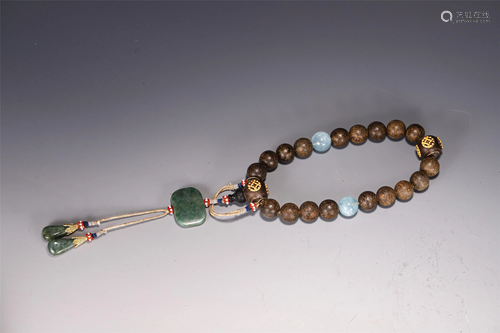 A CHINESE CHENXIANG WOOD 18-BEAD PRAYER BEADS