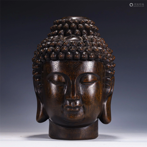 A CHINESE CARVED CHENXIANG WOOD BUDDHA HEAD