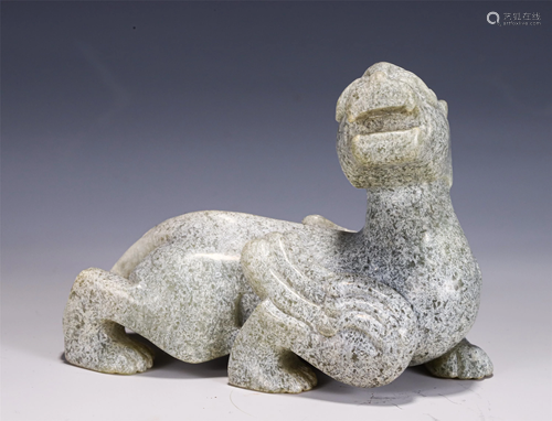 A CHINESE ARCHAISTIC JADE CARVED MYTHICAL BEAST