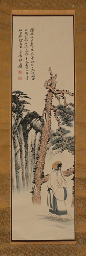 A CHINESE SCROLL PAINTING AND FIGURE AND PINE TREE