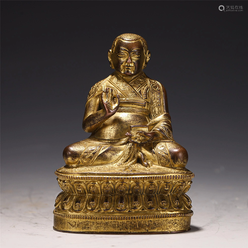 A CHINESE GILT BRONZE SEATED FIGURE OF TIBETAN BUDDHA