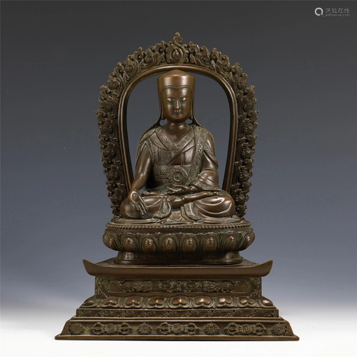 A CHINESE BRONZE SEATED FIGURE OF BUDDHA