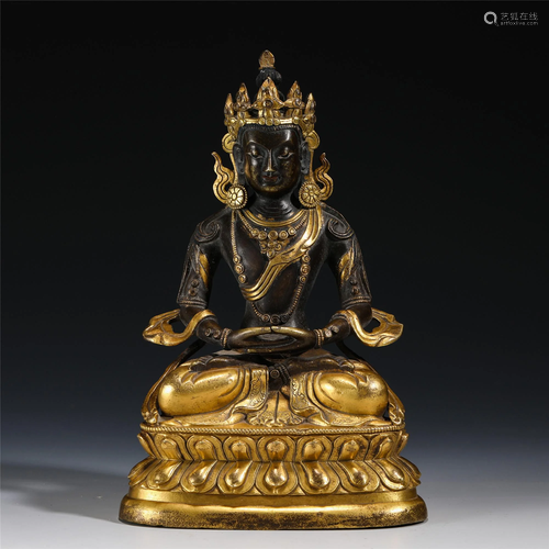 A CHINESE GILT BRONZE SEATED FIGURE OF BUDDHA