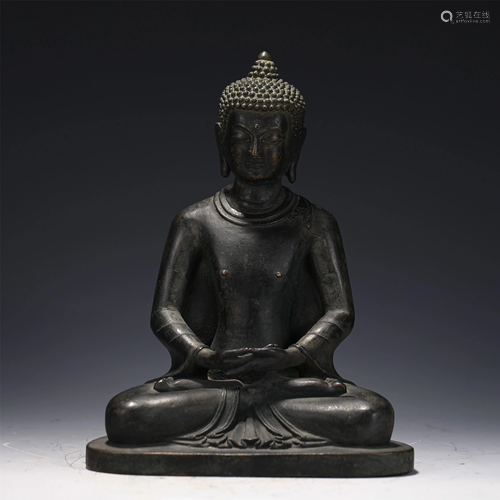 A CHINESE BRONZE SEATED FIGURE OF BUDDHA