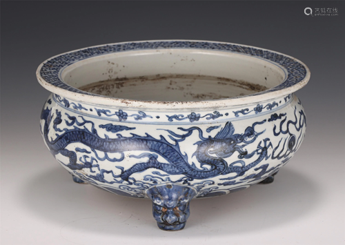 A CHINESE BLUE AND WHITE DRAGON PORCELAIN TRIPOD WAS…