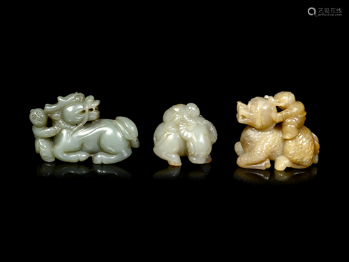 Three Chinese Celadon Jade Figures of Boys