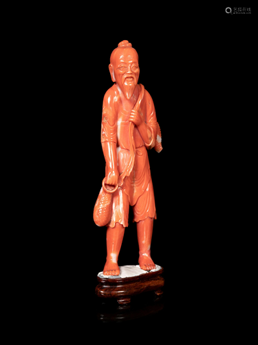 A Chinese Red Coral Figure of a Fisherman