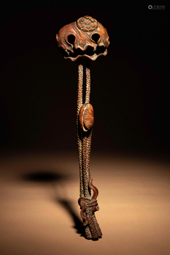 A Chinese Carved Boxwood 'Lotus and Frog' Ruyi Scepter